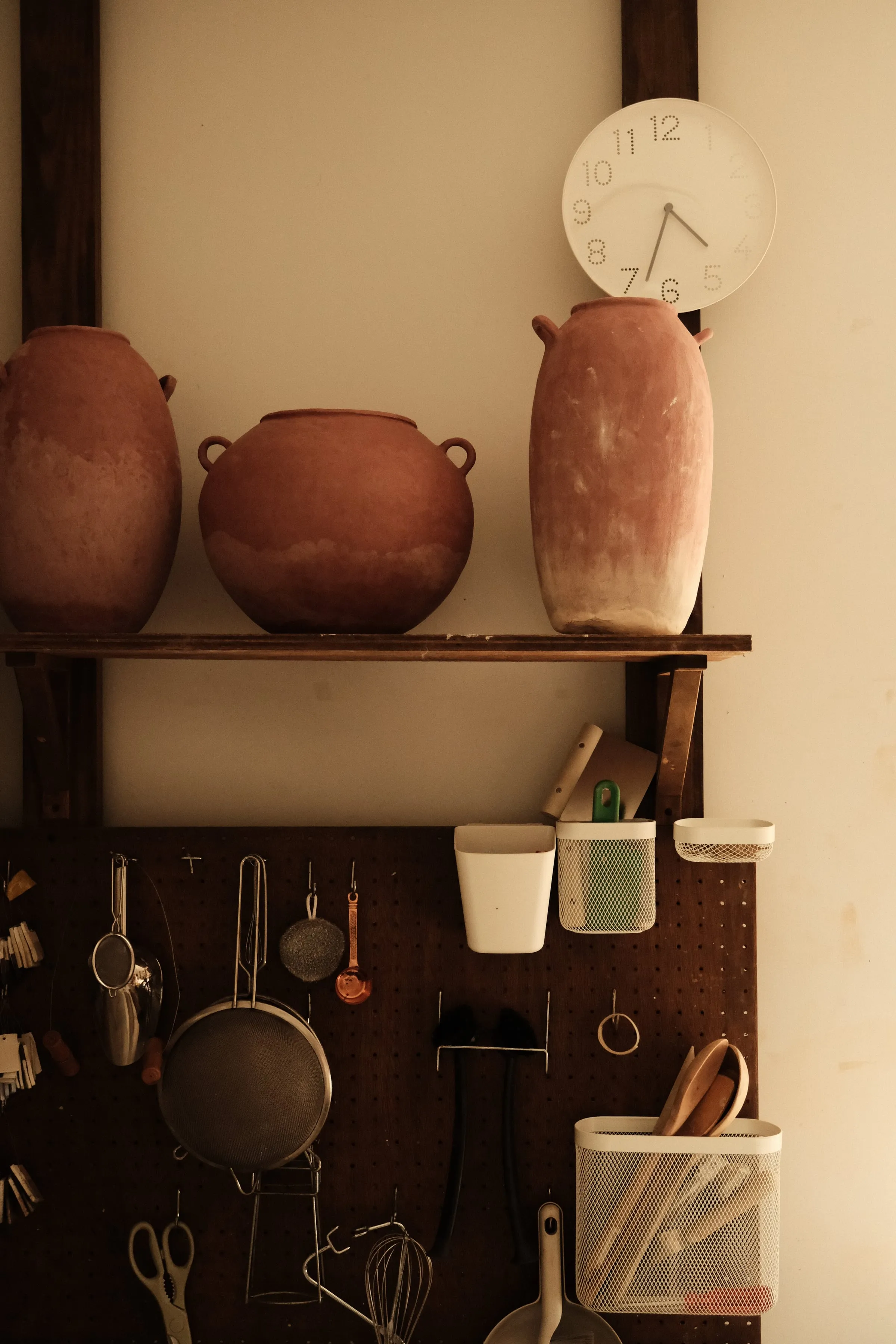 Studio shelf with pugged clay and tools